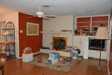 Living room with a fireplace, ornamental molding, 