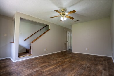 Unfurnished living room with wood finished floors,