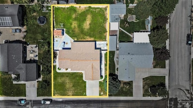 Aerial perspective of suburban area featuring property parcel outlined
