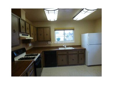 Property Photo. Kitchen with tiled flooring