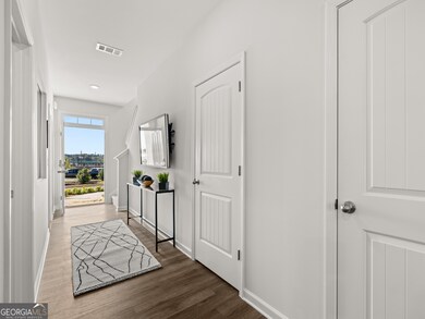 pearson front entryway with carpet staircase to th