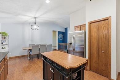 Spacious kitchen, wood laminate floors, freshly painted and updated lighting.