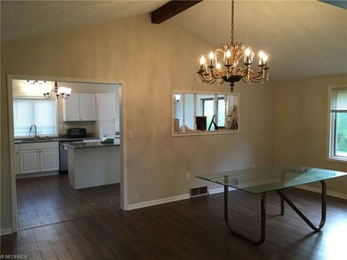 Large Vaulted Dining Room with double entry archways and beautiful chandelier