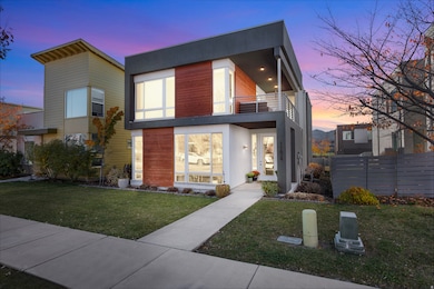 Modern home with a balcony and stucco siding
