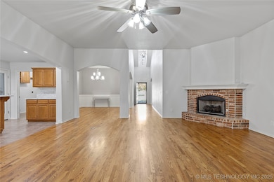 Family room with corner fireplace, view of entry and flex room, Open to kitchen