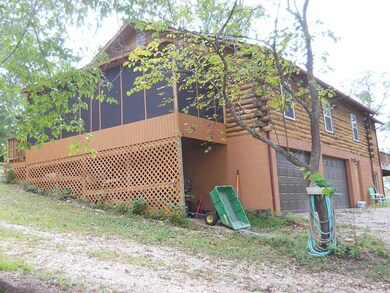 Exterior Back/Side. Garage and plenty of storage on lower level .