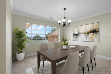 Stylish dining area with lake views and abundant natural light—ideal for everything from casual meals to elegant gatherings. Virtually Staged