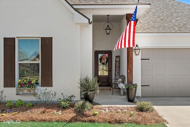 Entrance to property with brick siding, driveway, 