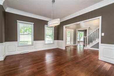 Formal Dining Room features wainscoting, crown mol