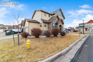 View of front of house featuring a garage and a fr