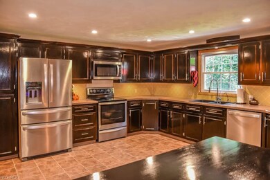 Spacious kitchen with stainless steel appliances.