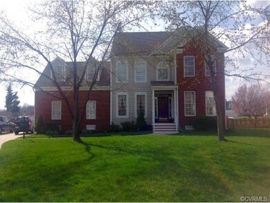 Level lot. Partial brick and vinyl home in the pla