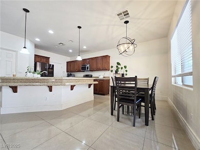 Kitchen featuring appliances with stainless steel