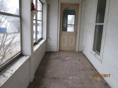 Front porch facing south.  Also a door on this sid