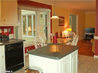 Kitchen - View from kitchen into family room and o