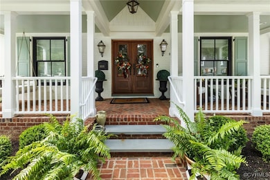Brick walkway, bluestone steps up to full front po