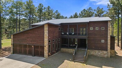 View of front of property with stairway, metal roo