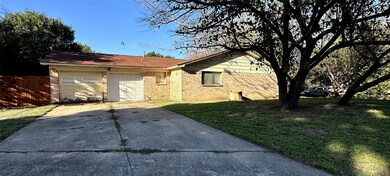 View of front facade featuring a garage and a fron