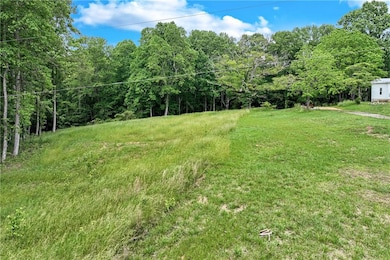 View of yard with a wooded view