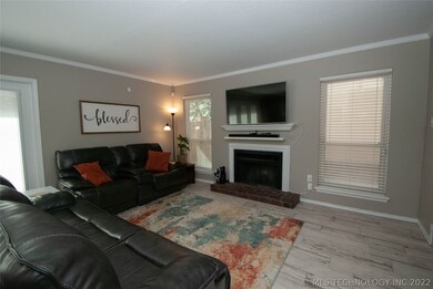 Fireplace flanked by 2 great windows