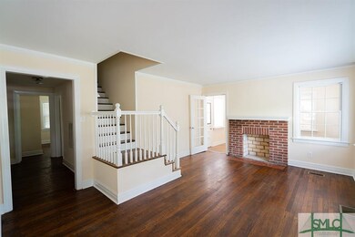 Living room with working fireplace and optional ga