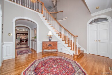 Dramatic Foyer with Turned Staircase