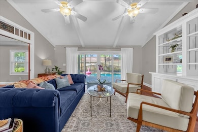 Great Room with Built-Ins and view of the Pool