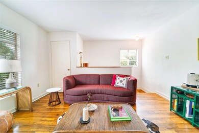 Living area featuring hardwood / wood-style floor
