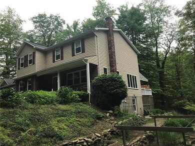 Front Side View of Two Story Home with Covered Dec