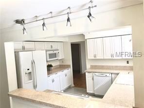 Spacious kitchen with a kitchen window to the back