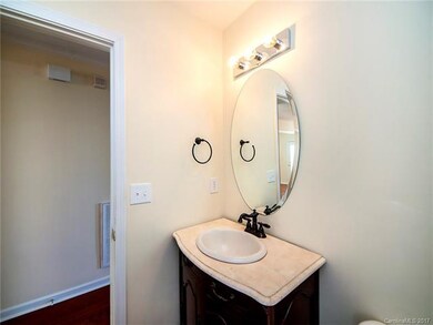 1/2 bath - Powder room off foyer for guests.
