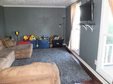 Formal living room with crown molding, could also 