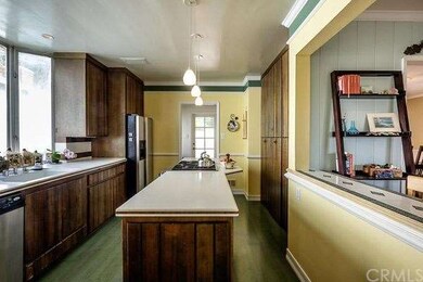 Open and inviting kitchen with center island, over