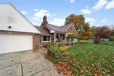 You're be greated with a large driveway and brick 