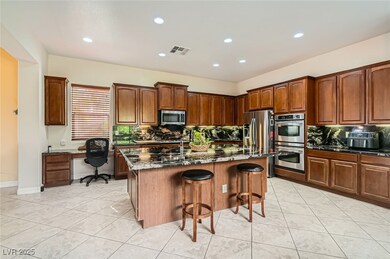 Kitchen featuring a kitchen breakfast bar, stainle