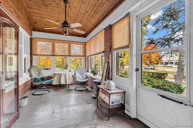 Sunroom with wooden ceiling, hardwood / wood-style floors, ceiling fan, and vaulted ceiling