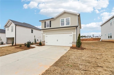 View of front of property with a garage, central A