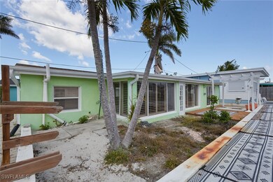 Back of property with a patio and stucco siding