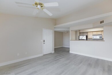 Unfurnished living room with light wood-style floo