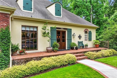 Doorway to property with stucco siding, roof with 