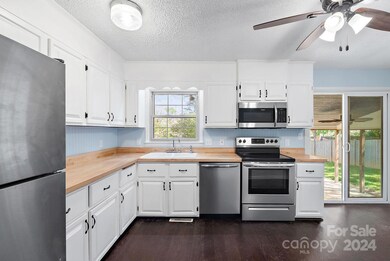 Generous Kitchen with lots of Cabinets and Counter Space