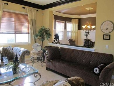 Formal Living room anchored by a fireplace with cu
