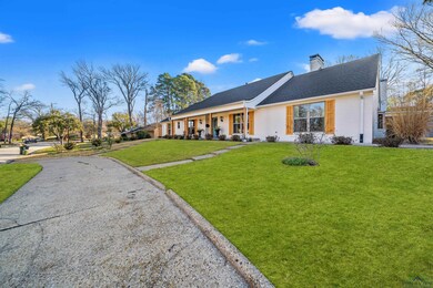 View of front of house featuring aphalt driveway, 