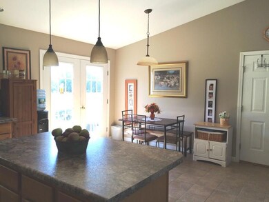The kitchen/dining area opens out to...