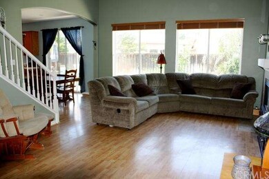 Living Room Looking Towards Kitchen Area and Backy