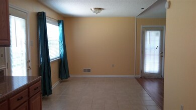 Brand new tile floor! Look how large this dining a