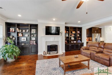 Beautiful built-ins surround the fireplace and cre