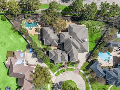 Discover a spacious lot with lush landscaping, a p