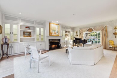 A light and bright formal living, with gas firepla
