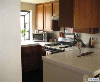 Kitchen also has garden window.